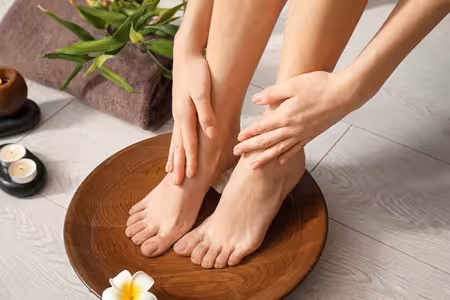 Luxurious manicure and pedicure in progress on elegant hands and feet
